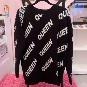 Black sweater w/ queen repeated on it